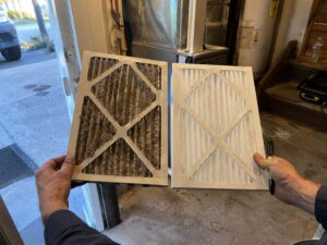 Comparing an old dirty filter to a new one by 7th Degree Heating and Air