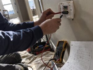 Checking thermostat wiring during a heating call in Gas Line Installation by 7th Degree Heating and Air