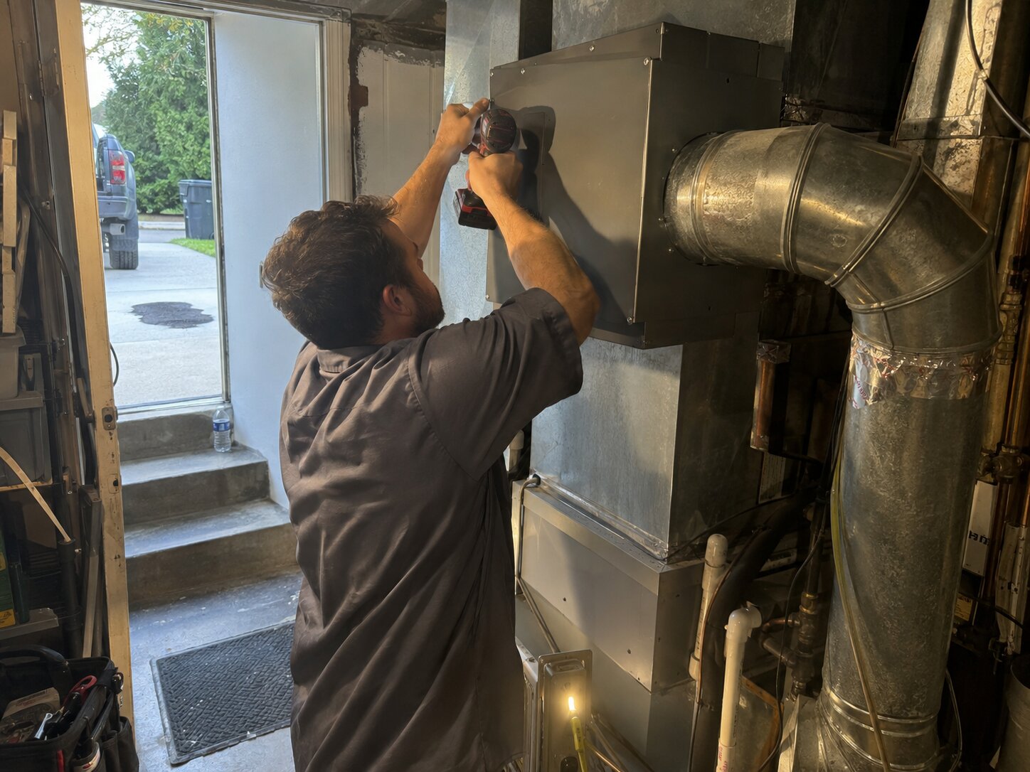 Installing a whole-home HEPA bypass air cleaner in Uv Light Treatment by 7th Degree Heating and Air