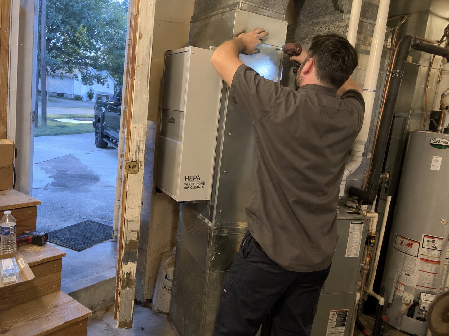 Installing a whole-home HEPA bypass air cleaner by 7th Degree Heating and Air