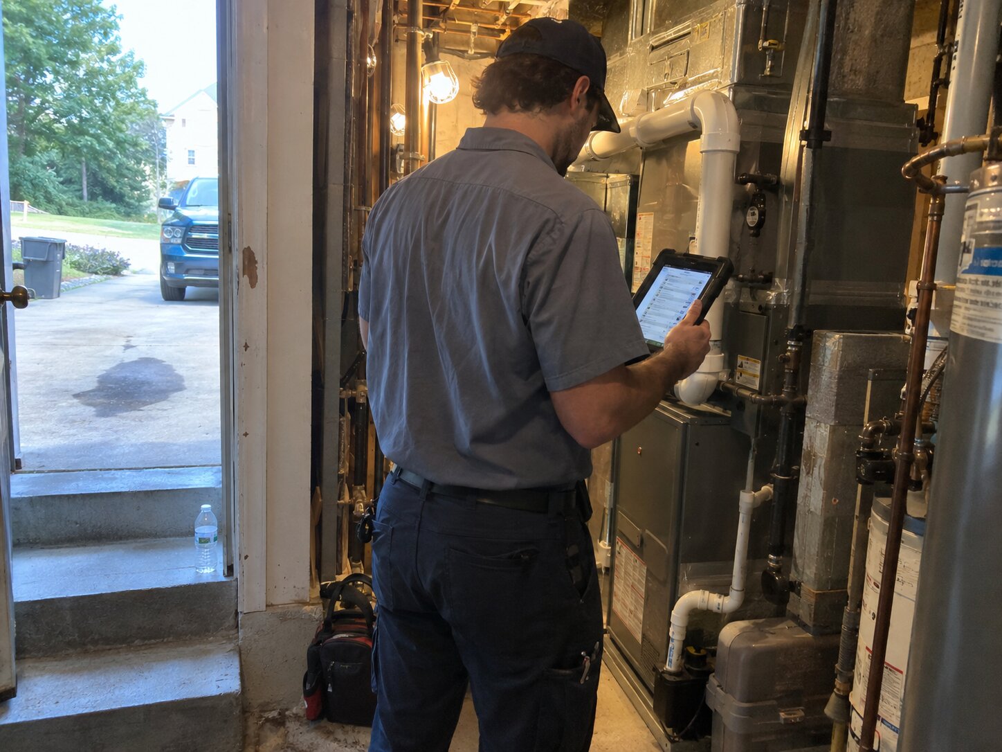 Residential HVAC maintenance walkthrough with a tablet checklist by 7th Degree Heating and Air