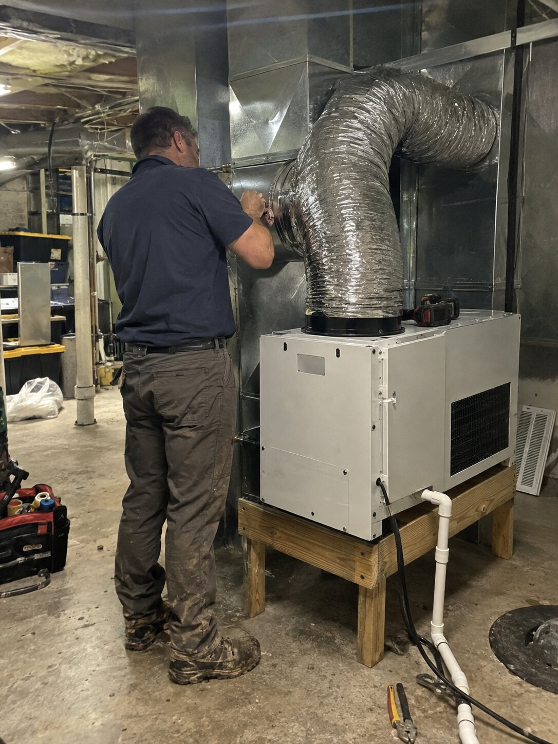 Installing a whole-home dehumidifier as part of an IAQ package in Carbon Monoxide Testing by 7th Degree Heating and Air